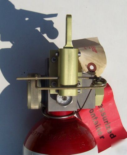 Halon 1301 lanyard type aircraft fire extinguisher . 