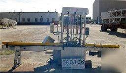 Used: 10 head rotary gravity filler, nozzles measure 5/